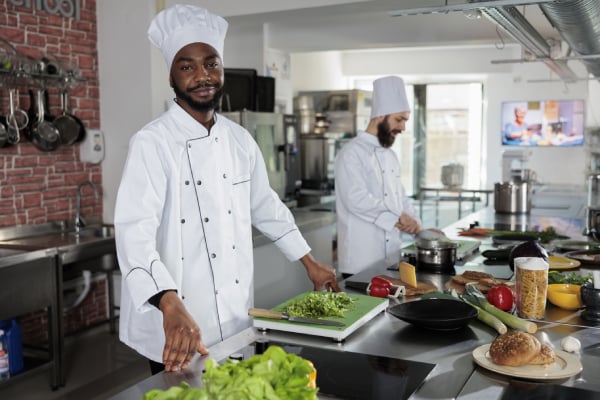 Who has to pay for kitchen work clothes?