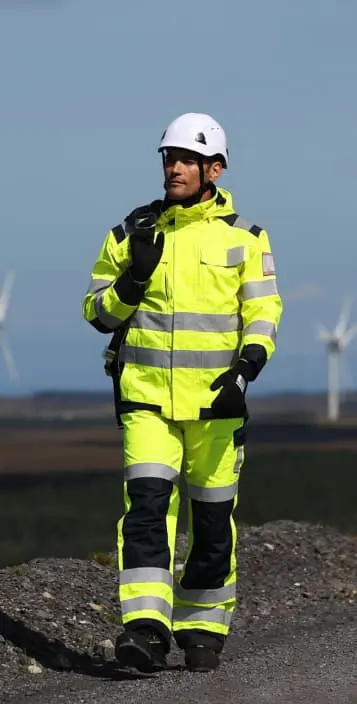 Man walking with a high visibility jacket